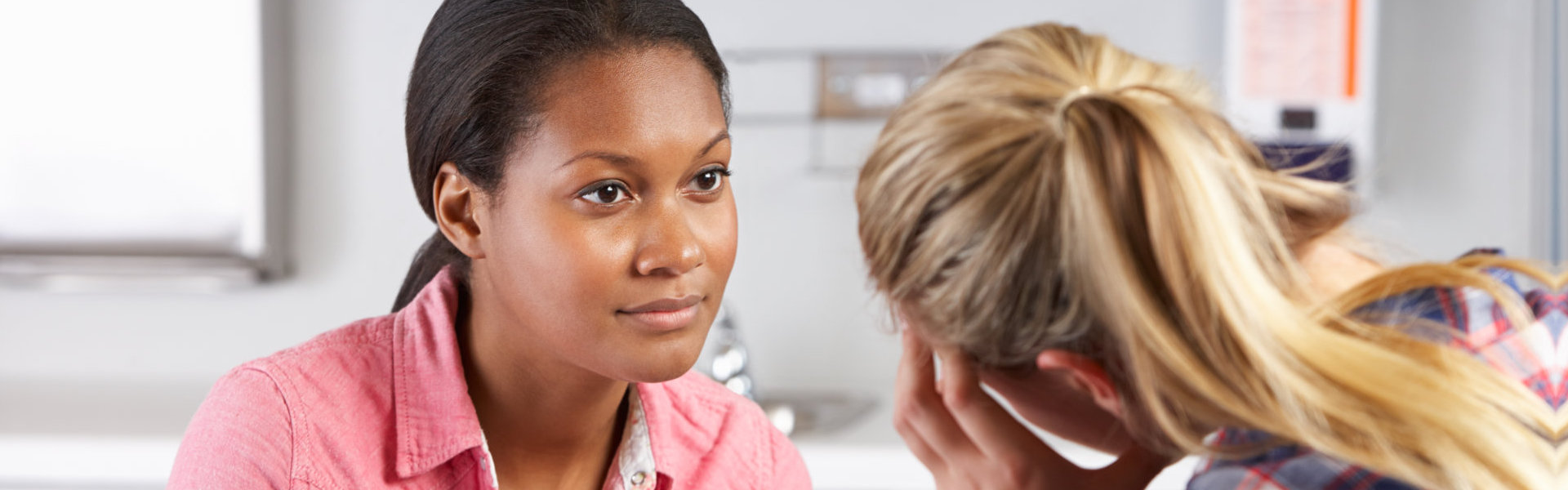 psychiatrist comforting her patient